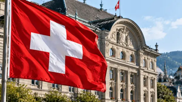 Close-up of the Swiss National Bank building and the Swiss flag