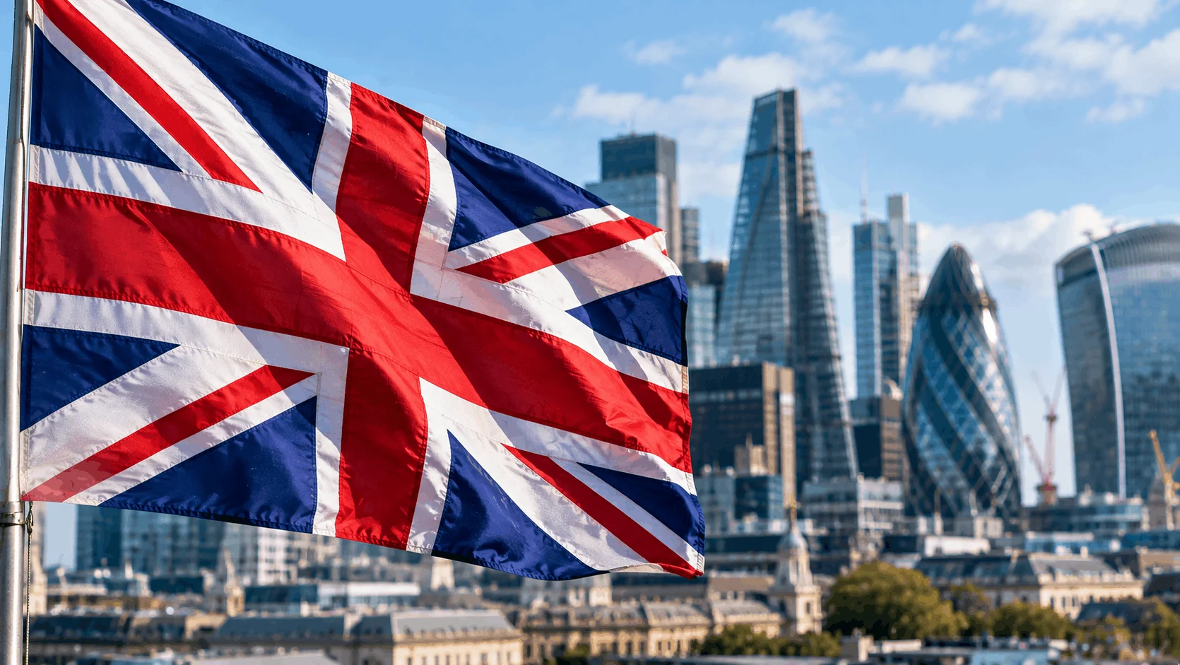 Close-up of the British flag with the London financial district in the background