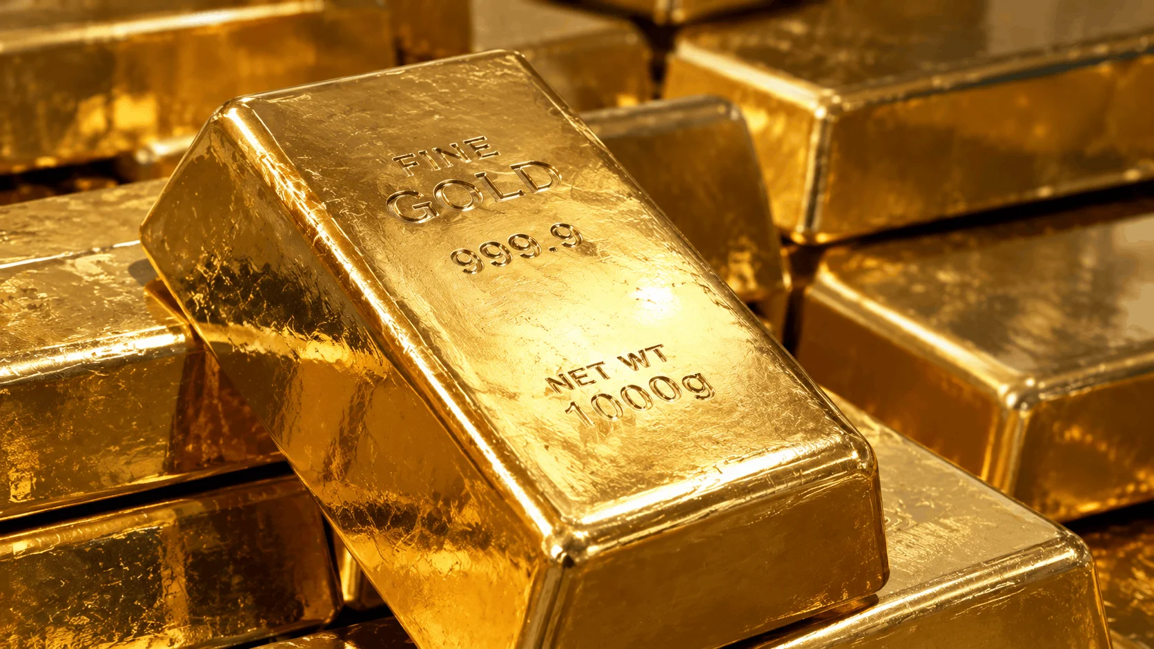 Real gold bullion bars with detailed metallic surfaces